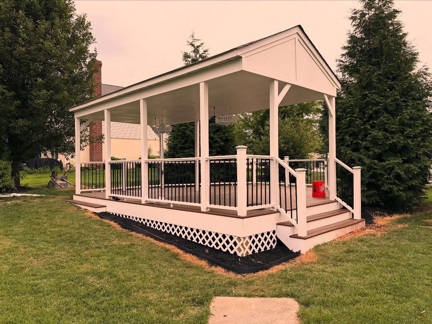 Covered porch with TimberTech decking and composite railing