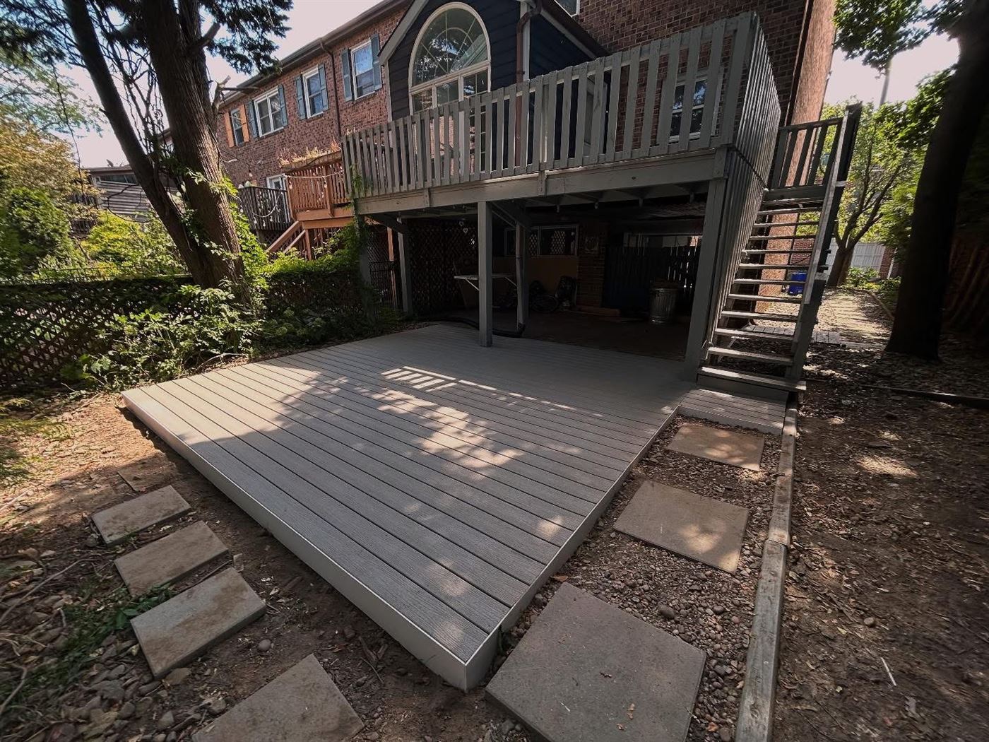Trex deck with white fascia built by Ridgeline Carpentry