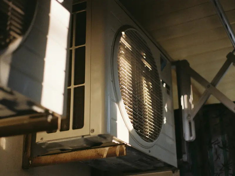 Outdoor air conditioning unit in late sun