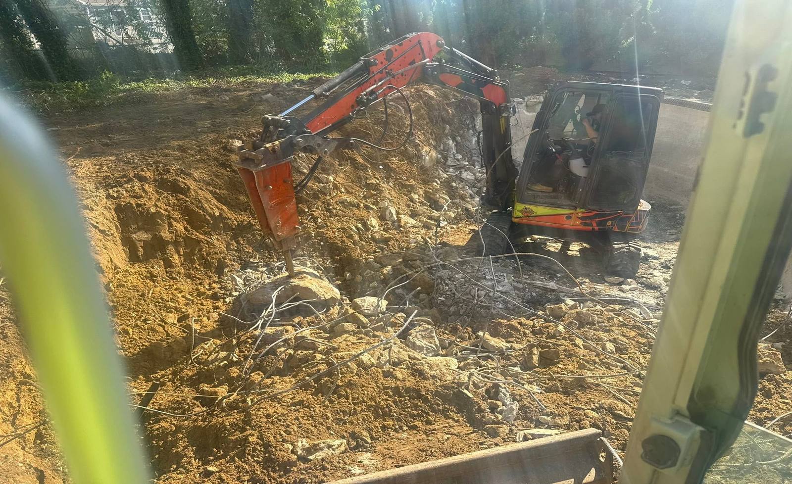 Ironline Excavating skid steer grading a residential lot