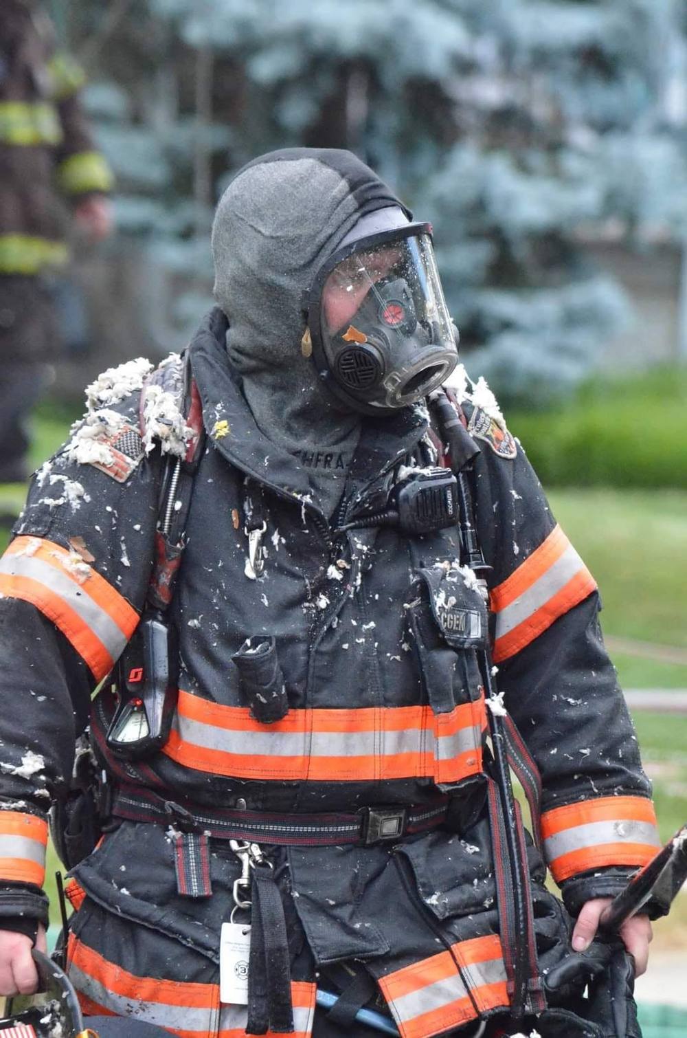 CHFC firefighter in turnout gear and SCBA after battling a fire