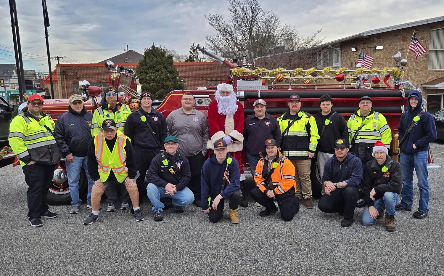 The volunteers of CHFC Station 3 with Santa and an antique engine